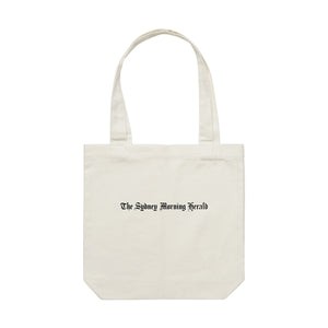 


Carry your morning paper and goods in this Sydney Morning Herald Tote Bag. Made from 100% cotton canvas ensuring durability and lifecycle. This everyday carry-all is part of our core collection and features Th...